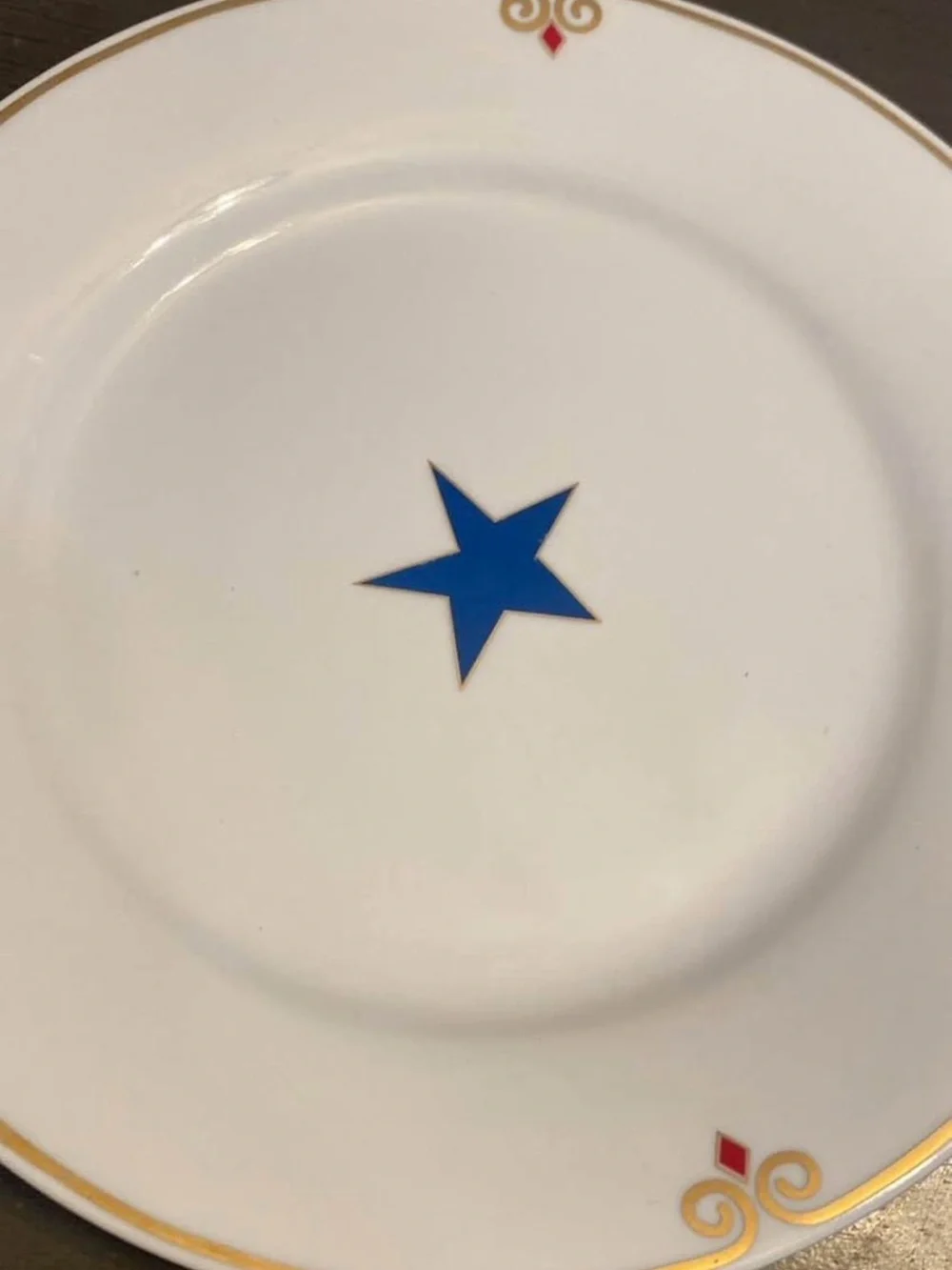 Pier 1 White  Plates with Multicolor Star Accents and Gold Trim